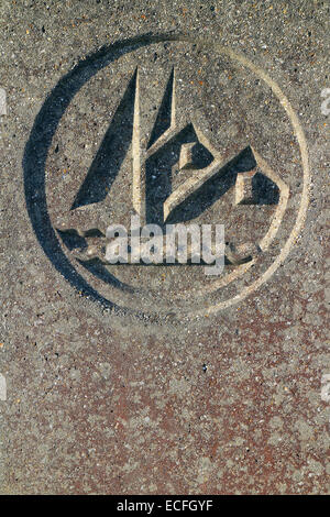 Concrete marker with the logo of Hythe Marina Village, a site of MDL Marinas on Southampton Water, Hampshire, UK Stock Photo