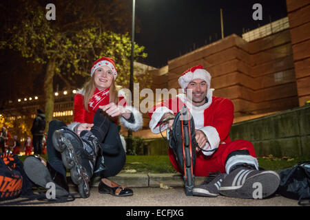 London, UK. 13th December, 2014. Hundreds of roller blading Santas from the weekly London Skate took to the streets of London to celebrate in style dressed as Father Christmas.This year the 9 miles route continue to be the biggest costumed street skate of the year. 13th Dec, 2014. © Velar Grant/ZUMA Wire/ZUMAPRESS.com/Alamy Live News Stock Photo