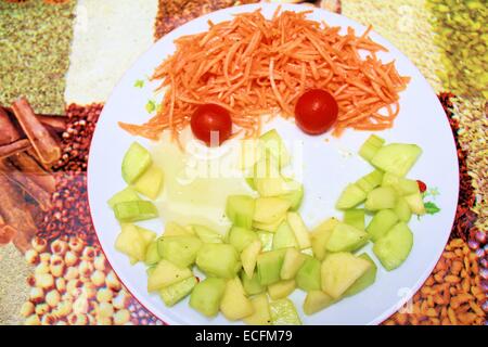 Funny face man made of cucumbers ,pears, tomatoes and carrots Stock Photo