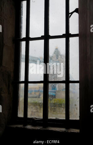 view through a window of tower of london onto tower bridge Stock Photo