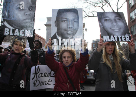 NEW YORK, NEW YORK - DECEMBER 13: Kristin Reed (from left), Caron Atlas and Julia Hillman Craig march from Washington Square Park in Greenwich Village, New York during Millions March NYC on December 13, 2014, to protest the use of excessive force by police officers on unarmed Black men and the not guilty verdict delivered in the Eric Garner case in Staten Island, New York.  (Photo by Sean Drakes/Alamy) Stock Photo