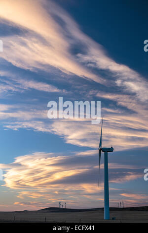 A Chinook arch sweeps across the southern Alberta Prairies near Pincher Creek  Wind Turbines dot the hillsides beneath the cloud Stock Photo