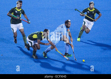 Bhubaneswar. 13th Dec, 2014. Indian hockey player Sardar Singh (R2) controls the ball during the semifinal match against Pakistan at Hero Hockey Champions Trophy 2014 match at Kalinga Stadium in Bhubaneswar on December 13, 2014. India lost 3-4. © Zheng Huansong/Xinhua/Alamy Live News Stock Photo