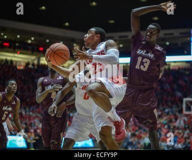 Albuquerque, New Mexico, USA. 13th Dec, 2014. Roberto E. Rosales.Lobo Tim Jacobs(Cq)middle, drives to the basket around UL Monroe's Majok Deng(Cq), right, late in the second half. Lobos defeated ULM 54 TO 46. © Roberto E. Rosales/Albuquerque Journal/ZUMA Wire/Alamy Live News Stock Photo