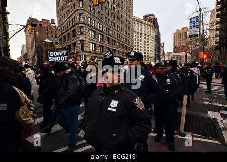 New York, USA. 13th December, 2014. New York City police officers on duty as thousands of people marched along New York City streets to protest against police violence against blacks. Credit:  Joseph Reid/Alamy Live News Stock Photo