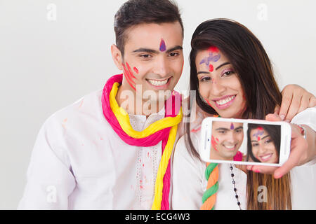 indian married couple Holi Festival phone Selfie Stock Photo