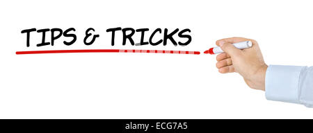 Hand with pen writing Tips and Tricks Stock Photo