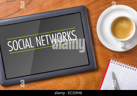 Tablet on a desk - Social Networks Stock Photo