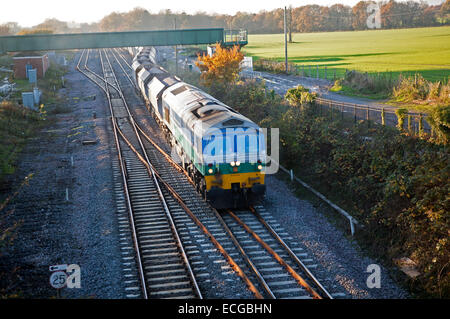 Diesel locomotive freight train on the West Coast mainline at Woodborough, Wiltshire, England, UK Stock Photo