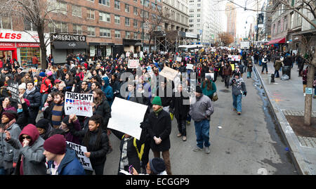 New York, NY USA - December 13, 2014: Protesters march against police brutality and grand jury decision on Eric Garner case on 14th street Stock Photo