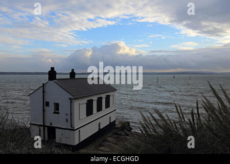 Solent, Hampshire, UK. 14th Dec, 2014. Lepe on the Solent, Hampshire, UK. The Watch House on the coast at Lepe looks out over the stormy waters of the Solent churned up by the strong winds blowing along the south coast of England today. Credit:  Julia Gavin UK/Alamy Live News Stock Photo