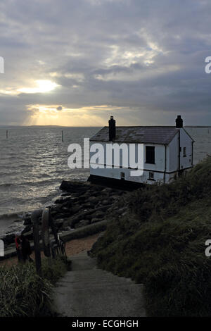 Solent, Hampshire, UK. 14th Dec, 2014. Lepe on the Solent, Hampshire, UK. The Watch House on the coast at Lepe looks out over the stormy waters of the Solent churned up by the strong winds blowing along the south coast of England today. Credit:  Julia Gavin UK/Alamy Live News Stock Photo