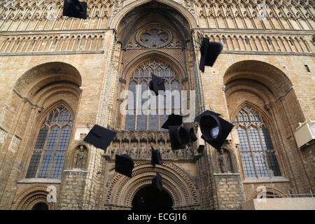 Graduation caps thrown into air at Lincoln Cathedral Stock Photo