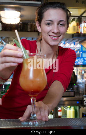 Female bartender serving cocktail Stock Photo