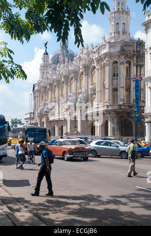 Pedestrians attempt to cross a busy street across from the Hotel Inglaterra on Paseo de Marti Paseo del Prado in Havana Cuba Stock Photo