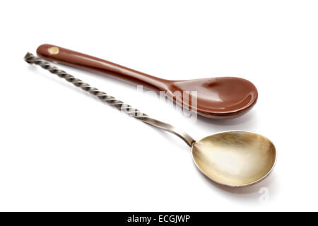 Steel and ceramic spoon on a white background Stock Photo