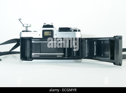 An old slr film camera loaded with a 35mm film cassette Stock Photo - Alamy
