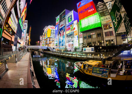 Japan Osaka Dotonbori nightlight signbox canal water reflection with tour boat Stock Photo