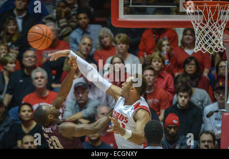 Albuquerque, New Mexico, USA. 13th Dec, 2014. Roberto E. Rosales.Lobo Xavier Adams(Cq), right, swats away a shot intended by UL Monroe's Chinedu Amajoyi(Cq) in the second half Saturday night. Lobos defeated ULM 54 TO 46. © Roberto E. Rosales/Albuquerque Journal/ZUMA Wire/Alamy Live News Stock Photo