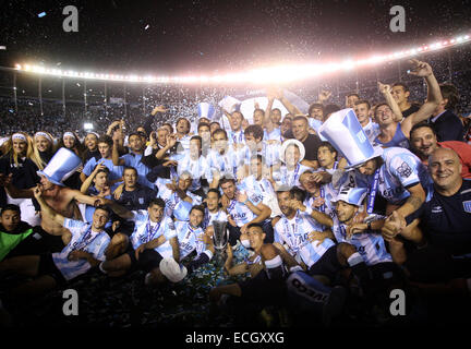 Avellaneda, Argentina. 14th Dec, 2014. Players of Racing Club celebrate with the trophy at the end of the Final match against Godoy Cruz of Argentinean Soccer First Division at Presidente Peron Stadium, in Avellaneda City, 20km from Buenos Aires City, Argentina, on Dec. 14, 2014. © Martin Zabala/Xinhua/Alamy Live News Stock Photo