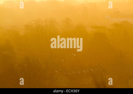 Wimbledon London,UK. 15th December 2014; Houses bathed in orange on a Dramatic colourful sunrise  in London Credit:  amer ghazzal/Alamy Live News Stock Photo