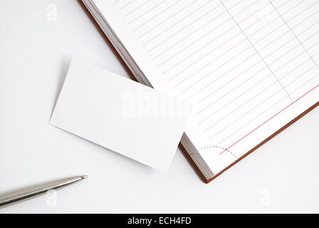 Empty business card with diary and pen isolated on white Stock Photo