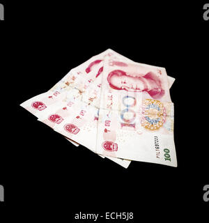 Modern Chinese yuan renminbi banknotes. Photo with selective focus isolated on black Stock Photo