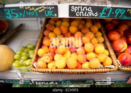 Mixture of locally grown produce and imported fruit in an organic supermarket UK Stock Photo