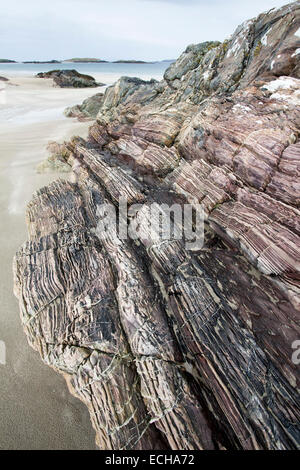 Layered red sandstone outcrop on Glassilaun Beach, Connemara, County Galway, Ireland. Stock Photo