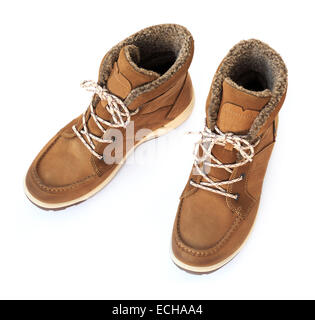 A pair of women's ladies brown leather warm fur-lined lace-up winter boots isolated on a white background from above. UK Stock Photo