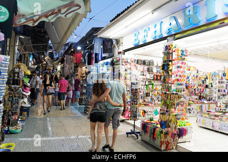 Athens, Greece - 17th July 2013: Couple shopping in a tourist area of Athens Stock Photo
