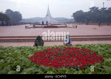 Dhaka, Bangladesh. 15th Dec, 2014. Sweeper sweep in front of National Martyrs' Memorial which is the symbol in the memory of the valour and the sacrifice of all those who gave their lives in the Bangladesh Liberation War of 1971.Massive preparations have been taken in and around the National Mausoleum where thousands of people will gather on the Victory Day to pay homage to the Liberation War martyrs. Credit:  ZUMA Press, Inc./Alamy Live News Stock Photo