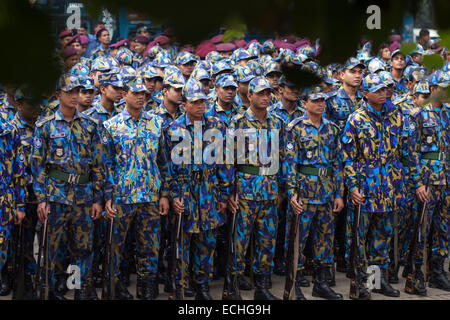 Dhaka, Bangladesh. 15th Dec, 2014. Bangladesh police preparing themselves  in front of National Martyrs' Memorial where thousands of people will gather on the Victory Day to pay homage to the Liberation War martyrs. Jatiyo Sriti Shoudho or National Martyrs' Memorial is the national monument of Bangladesh is the symbol in the memory of the valour and the sacrifice of all those who gave their lives in the Bangladesh Liberation War of 1971, which brought independence and separated Bangladesh from Pakistan. The monument is located in Savar, about 35 km north-west of the capital, Dhaka. © zakir hos Stock Photo