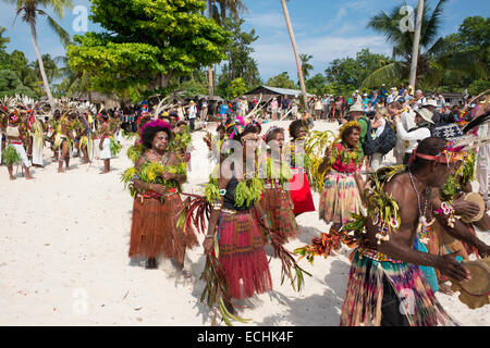 Melanesia, Papua New Guinea. Small island of Ali off the coast of mainland PNG. Local villagers in traditional attire dancing. Stock Photo