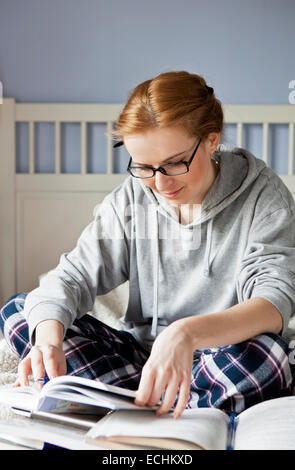 Young woman studying at home Stock Photo