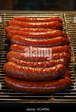 Traditional fresh polish sausages grilled on wire rack outdoor Stock Photo