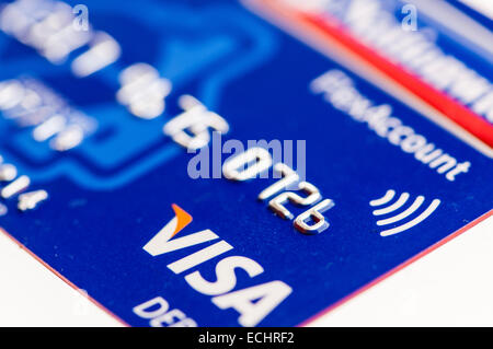 A Visa debit card with a logo for contactless payment. Stock Photo