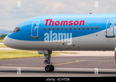 Side view of the front of a Thomson Boeing 757 aeroplane at Manchester Airport Stock Photo