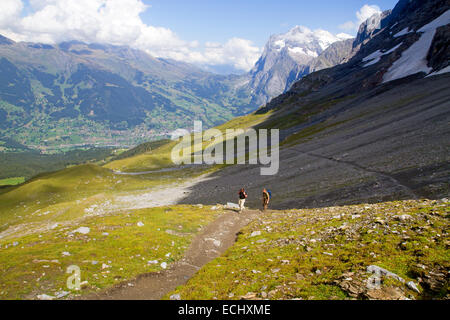 Hikers on the Eiger Trail, running along the base of the Eiger North Face Stock Photo