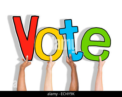 Diverse Hands Holding the Word Vote Stock Photo