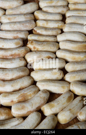 Ripe peeled bananas drying outdoors at a street stall in Chiang Mai, Thailand Stock Photo