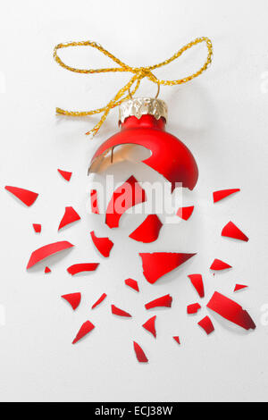 Broken Red Christmas tree ball isolated Stock Photo