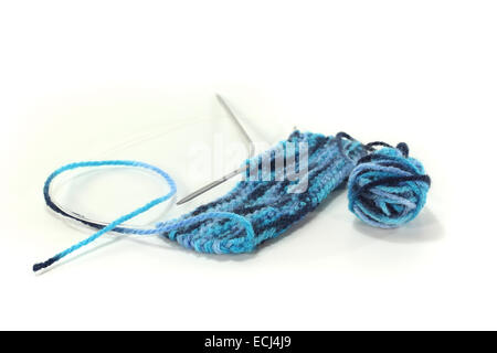 Knitting sample from blue mottled wool with circular needles Stock Photo