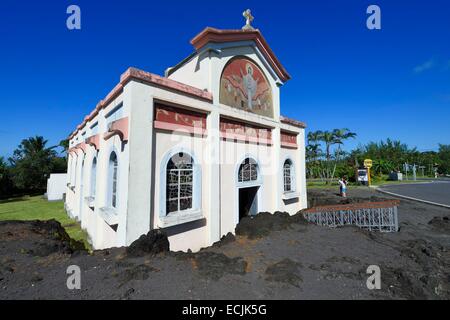 France, Reunion island (French overseas department), Piton Sainte Rose, Notre Dame des Laves church spared by the lava flow solidified today that stopped on his porch during an eruption of the Piton de la Fournaise volcano occurred in 1977 Stock Photo