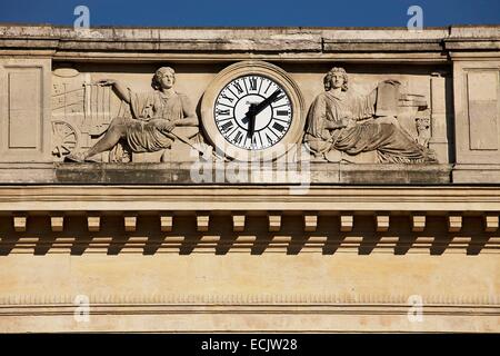 France, Paris, Place Denfert Rochereau, Pediment of the station, reliefs depicting allegories of two railway invention surrounding a clock Stock Photo