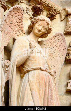 France, Marne, Reims, Notre Dame de Reims cathedral, listed as World Heritage by UNESCO, detail of the sculpture depicting L'ange au sourire (the Angel with the Smile) on the West façade Stock Photo