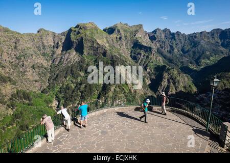 Portugal, Madeira island, the view point of Eira do Serrado, panoramic view over Curral das Freiras surrounded by the highest mountains of the island Stock Photo
