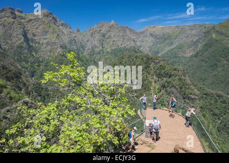 Portugal, Madeira island, hike from Portela to Ribeiro Frio in the heart of the Laurissilva forest, listed as World Heritage by UNESCO, panoramic view from the Balcoes view point over the highest mountains of the island Stock Photo