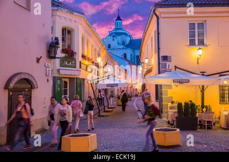 Lithuania (Baltic States), Vilnius, historical center listed as World Heritage by UNESCO, the small Jewish ghetto in the old town Stikliu's street with a view of the church bell tower of the Holy Spirit Stock Photo