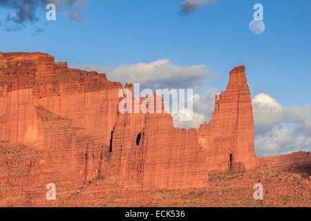 United States, Utah, Colorado Plateau, State Route 128 (SR-128) along the Colorado river designated the Upper Colorado River Scenic Byway, full moon rising over the Fisher Towers rock formations near Moab Stock Photo